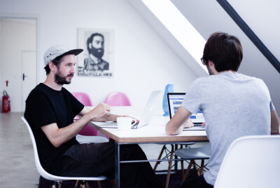 Jesús Espejo and Alex Gerund brainstorming at okay bueno's first office in Rudi-Dutschke-Str. 26 in Berlin Mitte